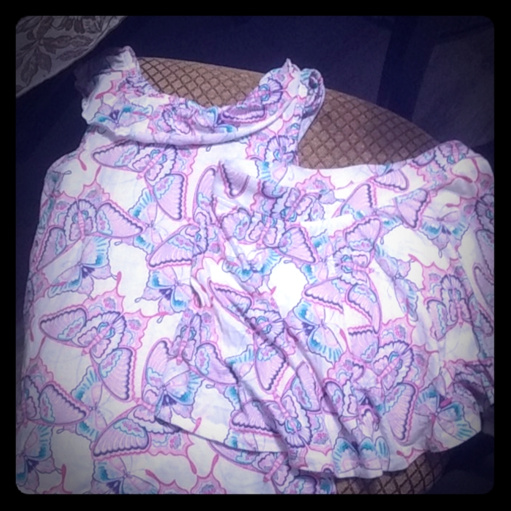 A two-piece top and skirt little girls clothing